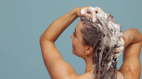 A woman washing her hair.